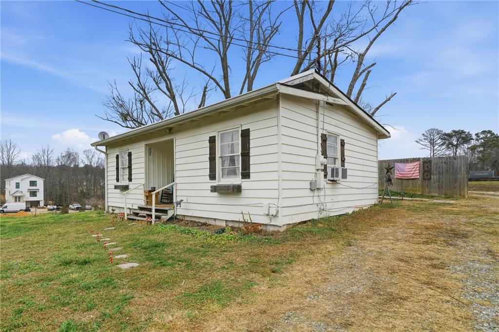 502 Old Canton Road Ball Ground, GA 30107 - Photo 2 of 29 a view of a house with a yard