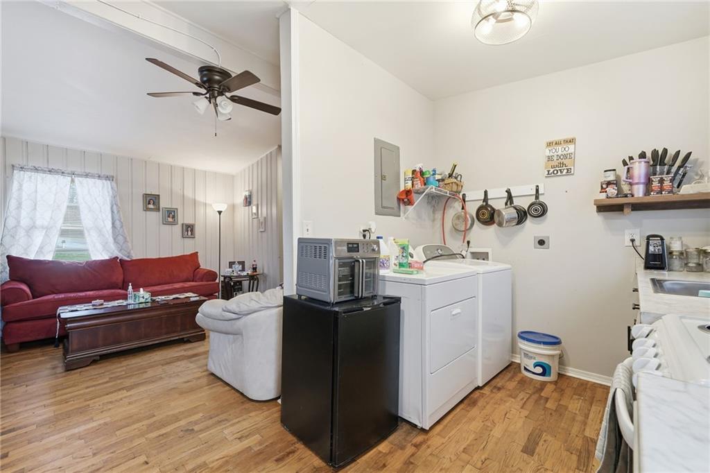 502 Old Canton Road Ball Ground, GA 30107 - Photo 22 of 29 a living room with furniture and a wooden floor
