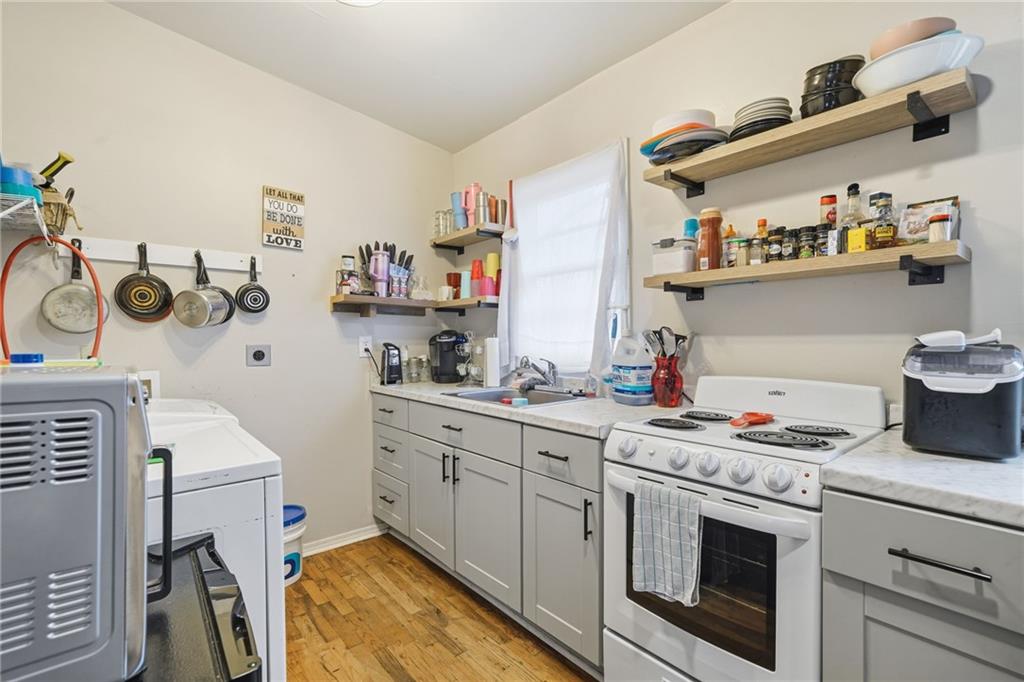502 Old Canton Road Ball Ground, GA 30107 - Photo 23 of 29 a kitchen with cabinets and appliances
