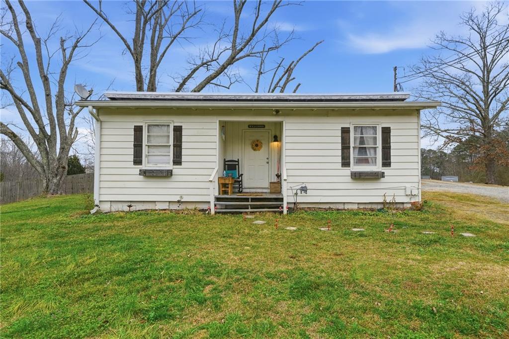 502 Old Canton Road Ball Ground, GA 30107 - Photo 3 of 29 a view of a house with a backyard