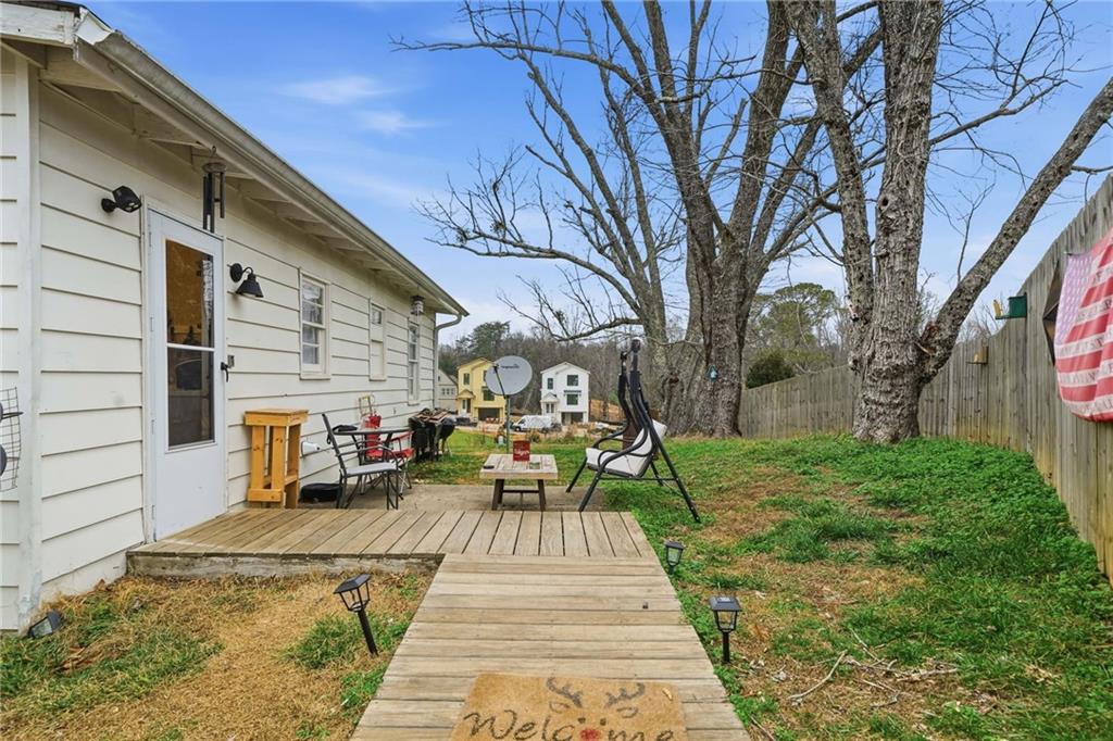 502 Old Canton Road Ball Ground, GA 30107 - Photo 7 of 29 a view of a backyard with sitting area