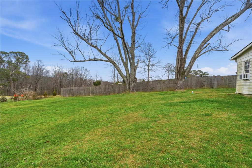 502 Old Canton Road Ball Ground, GA 30107 - Photo 9 of 29 a backyard of a house with lots of green space