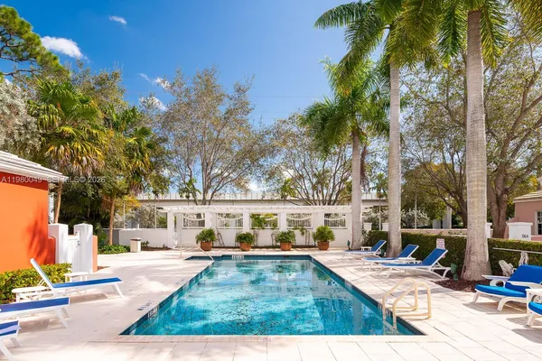 a view of swimming pool with lounge chair