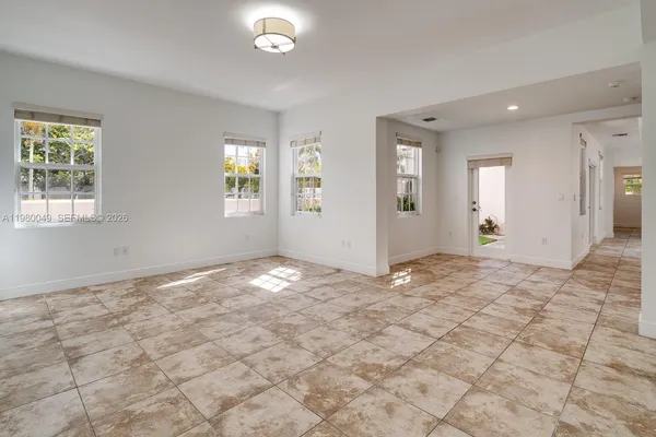 a view of a big room with windows and closet