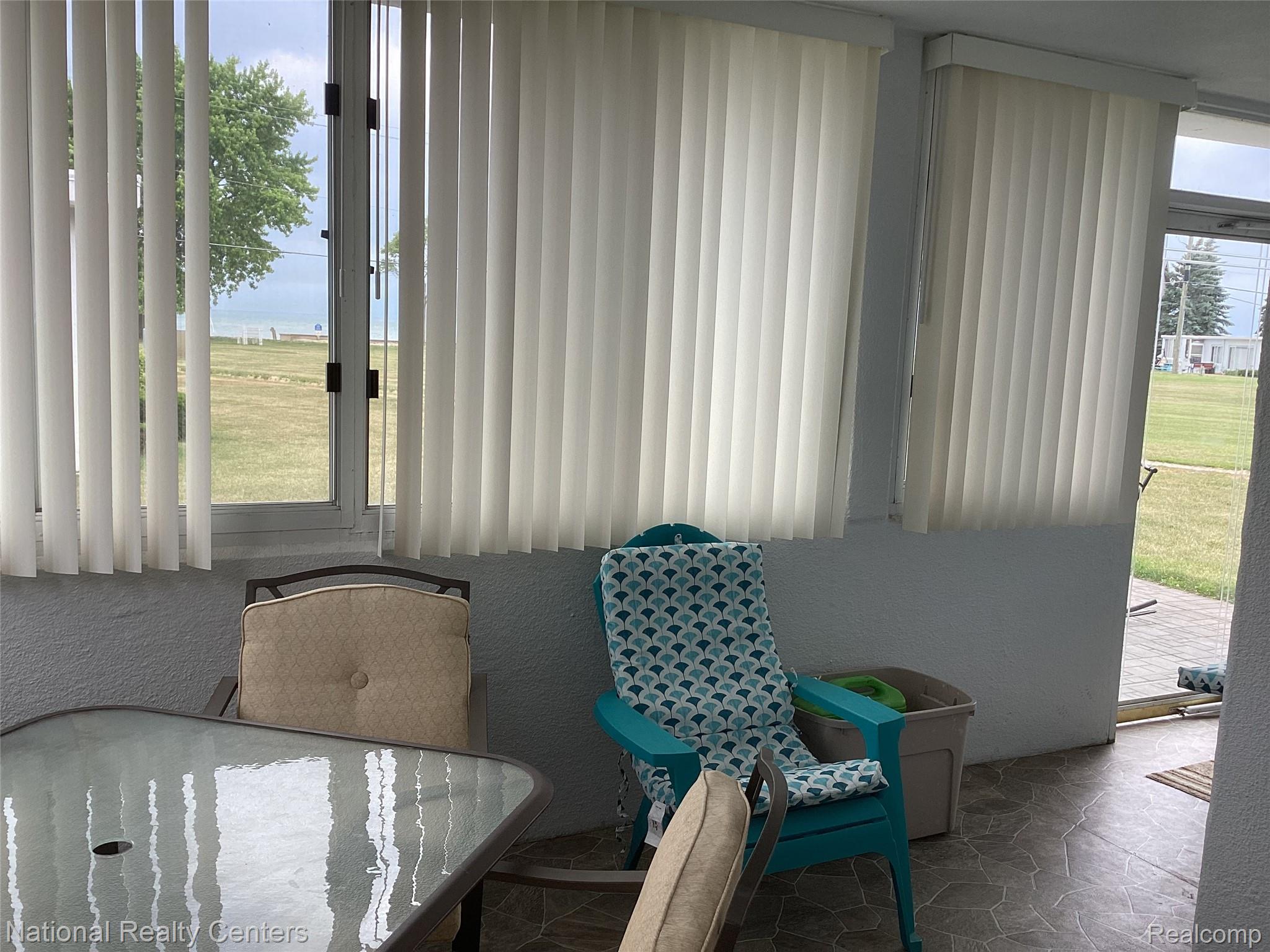 6024 Port Austin Road, Unit 5 Caseville, MI 48725 - Photo 49 of 56 See the beach and lake, watch the waves come in through the windows