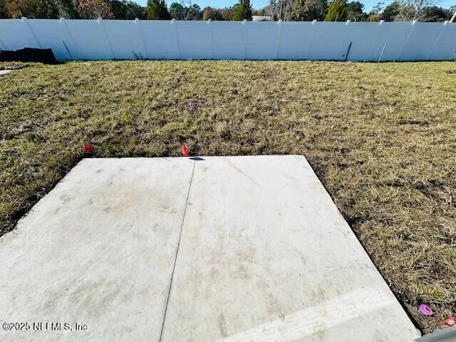 an aerial view of a house with outdoor space