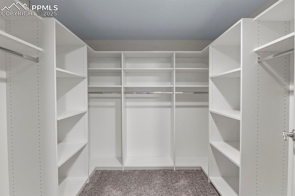 6868 Los Reyes Circle Colorado Springs, CO 80918 - Photo 39 of 47 a view of walk in closet with empty racks