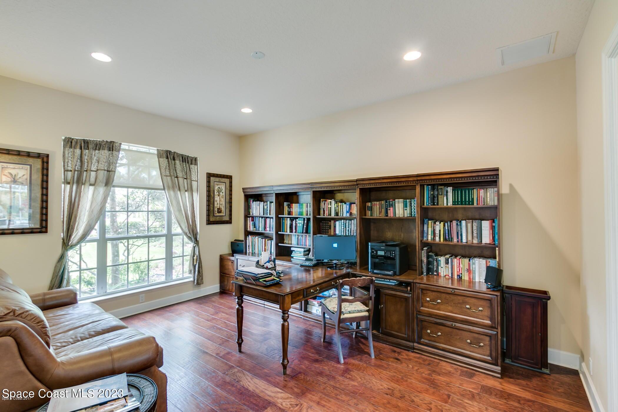 1840 Winding Ridge Circle Southeast Palm Bay, FL 32909 - Photo 15 of 41 a workspace with furniture window and wooden floor