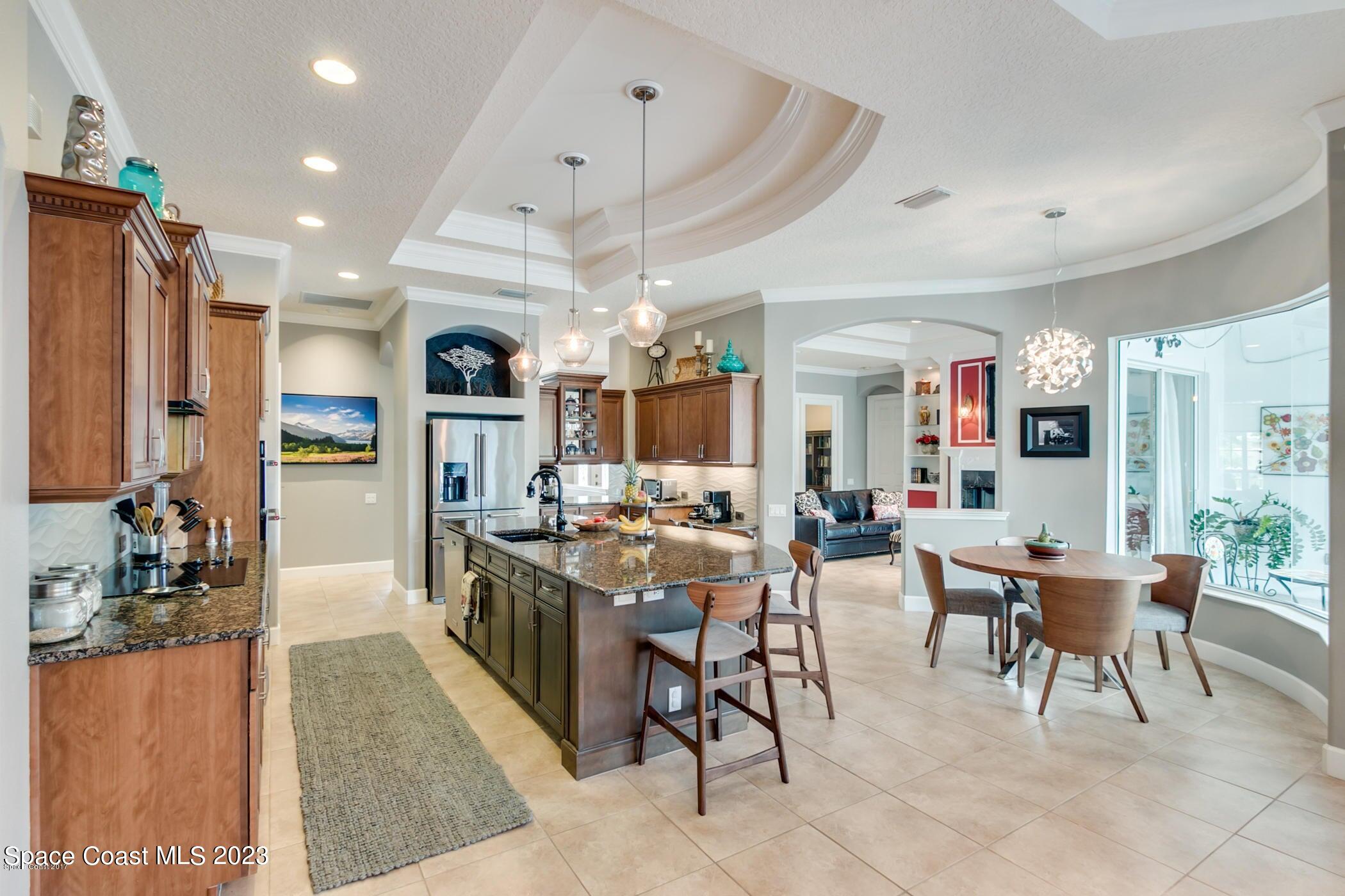 1840 Winding Ridge Circle Southeast Palm Bay, FL 32909 - Photo 16 of 41 a view of a kitchen and dining area