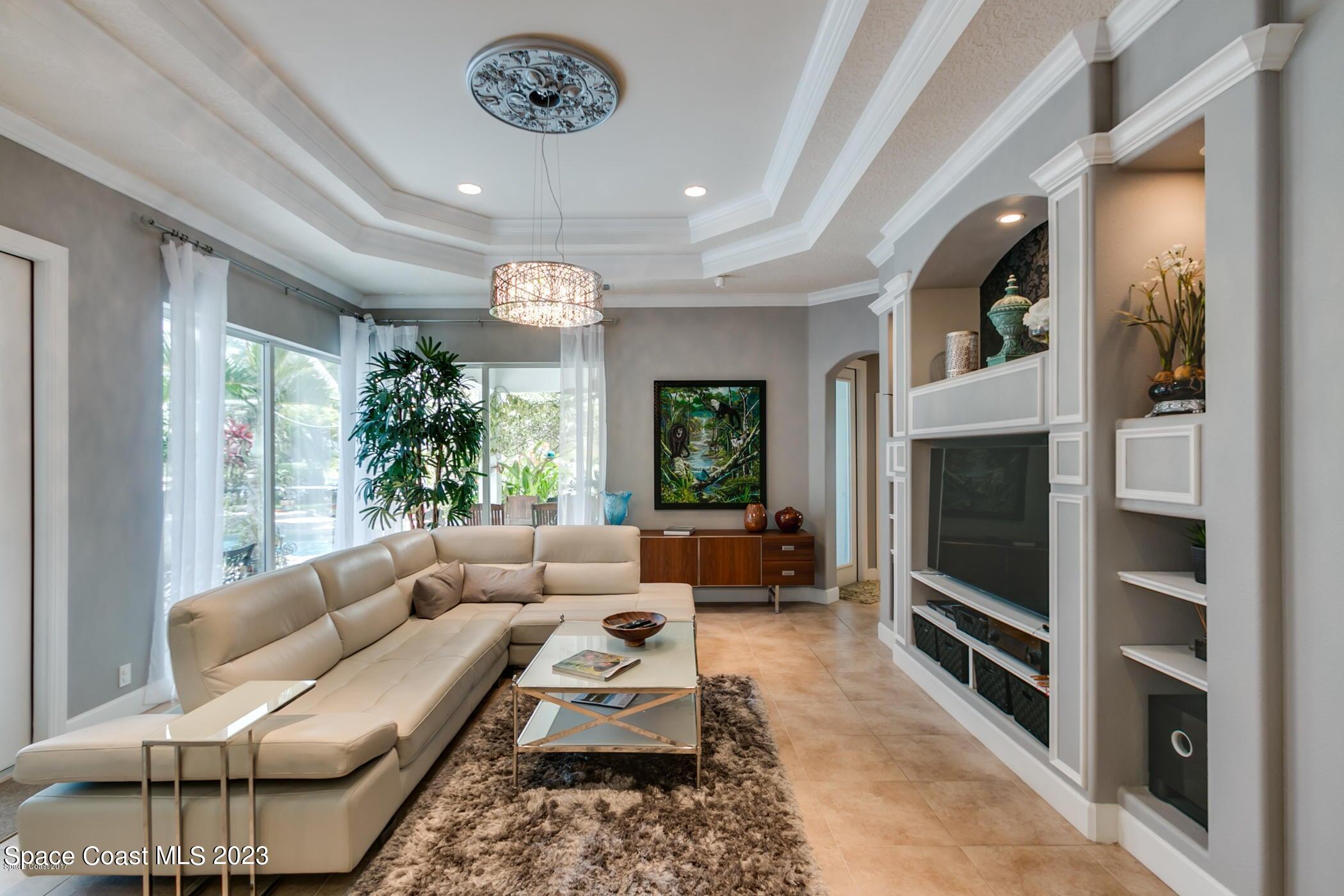 1840 Winding Ridge Circle Southeast Palm Bay, FL 32909 - Photo 20 of 41 a living room with furniture and a fireplace