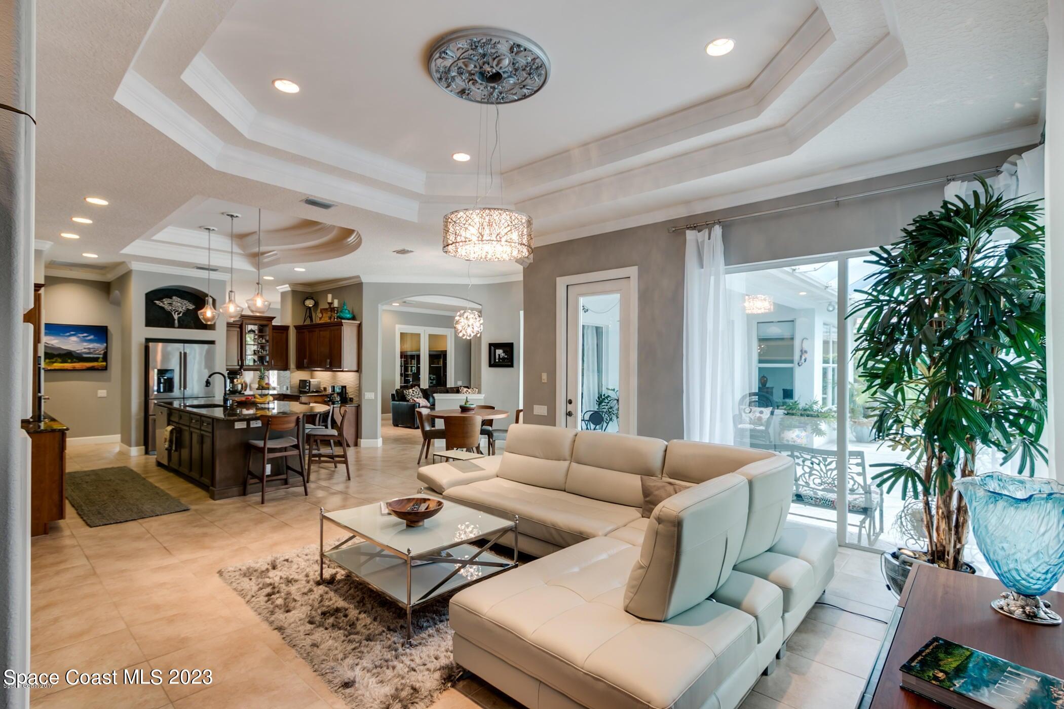1840 Winding Ridge Circle Southeast Palm Bay, FL 32909 - Photo 21 of 41 a living room with furniture and a large window