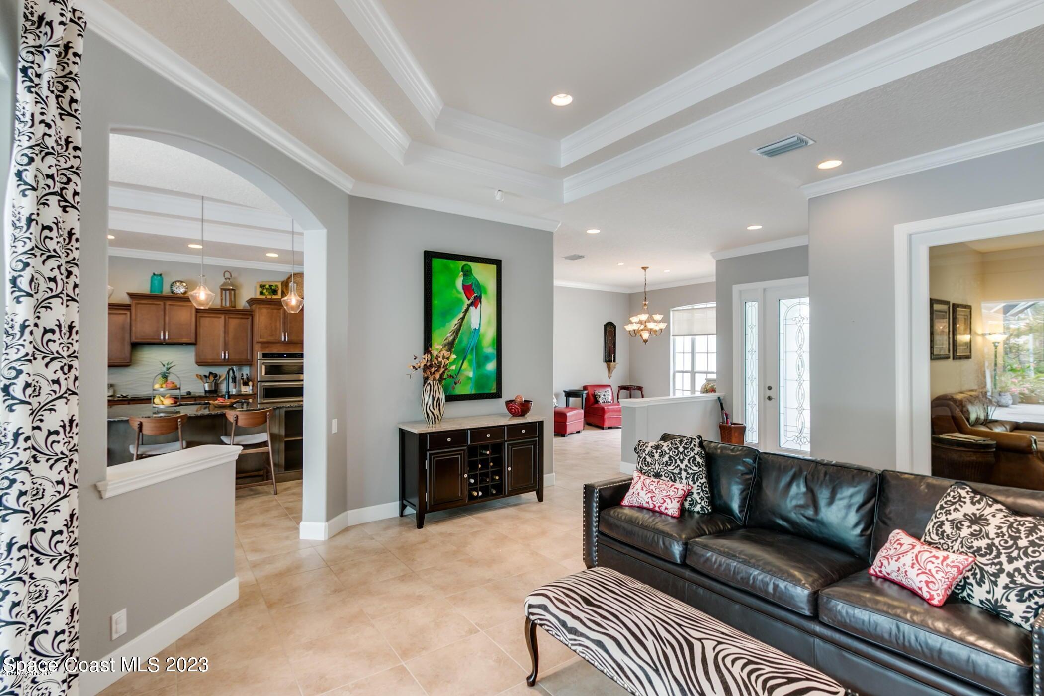 1840 Winding Ridge Circle Southeast Palm Bay, FL 32909 - Photo 22 of 41 a living room with furniture and a fireplace