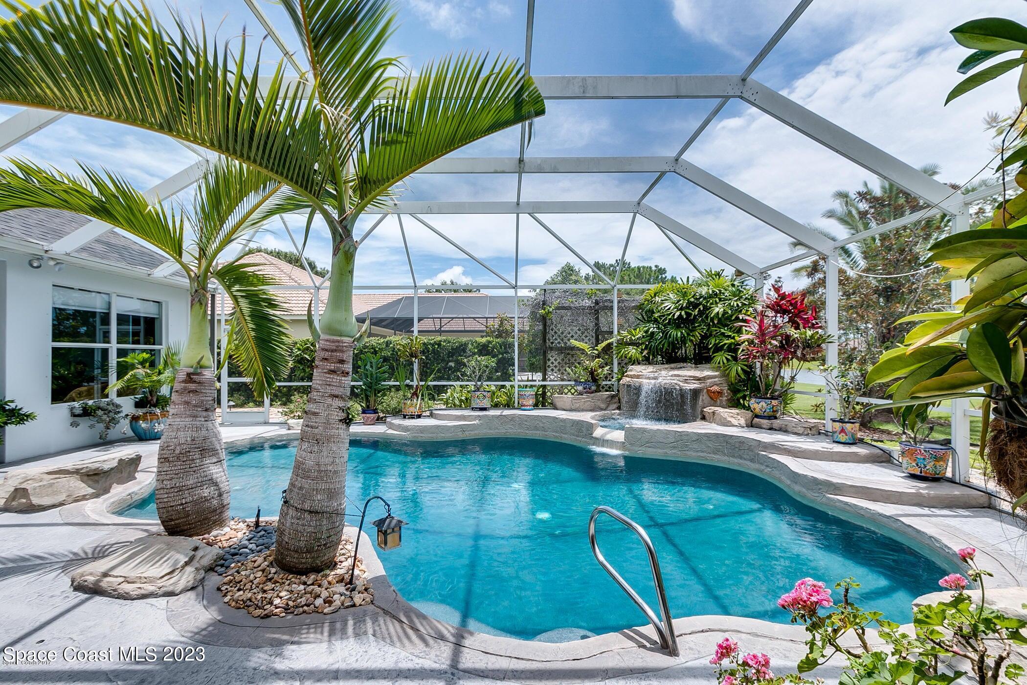 1840 Winding Ridge Circle Southeast Palm Bay, FL 32909 - Photo 3 of 41 a view of a swimming pool with a patio