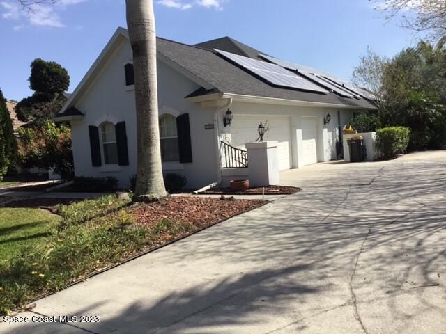 1840 Winding Ridge Circle Southeast Palm Bay, FL 32909 - Photo 41 of 41 a front view of a house with a yard