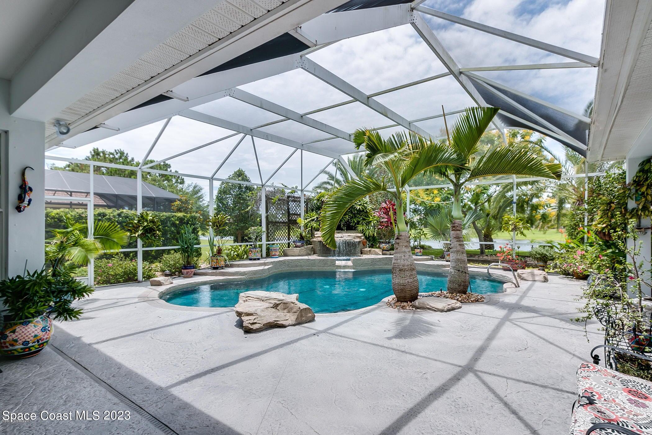 1840 Winding Ridge Circle Southeast Palm Bay, FL 32909 - Photo 9 of 41 a view of a backyard with sitting area and furniture