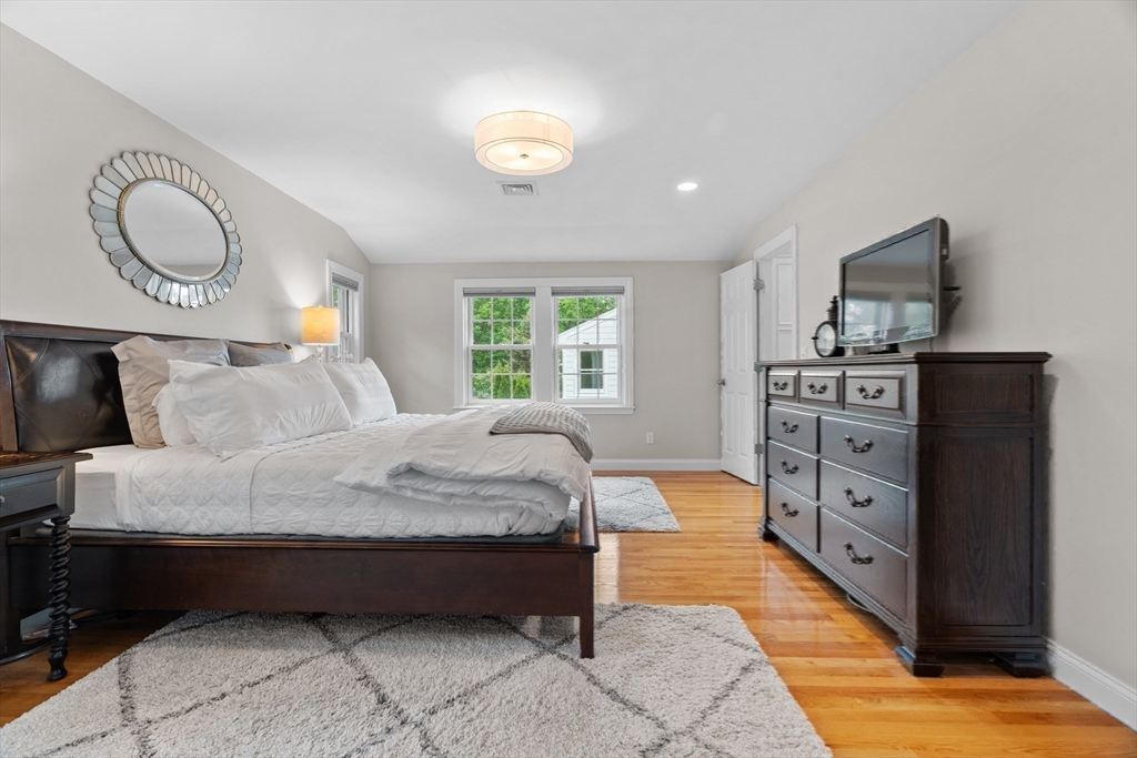 26 Cushing Road Westwood, MA 02090 - Photo 18 of 42 a spacious bedroom with a bed and window