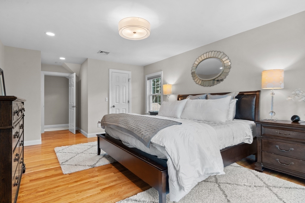 26 Cushing Road Westwood, MA 02090 - Photo 20 of 42 a bedroom with bed and wooden floor