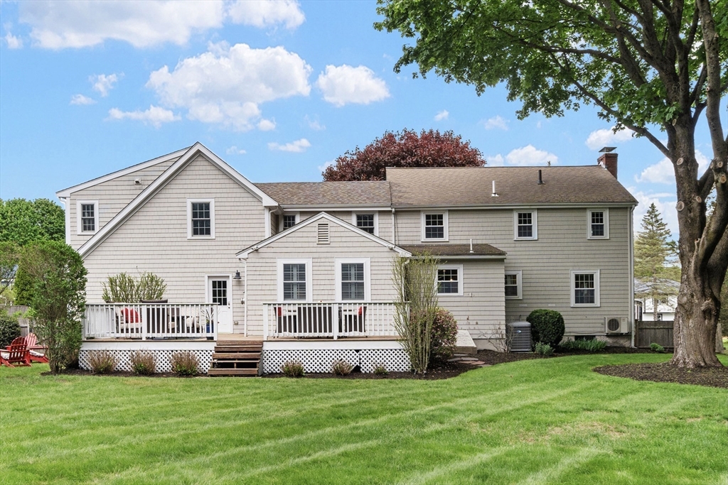 26 Cushing Road Westwood, MA 02090 - Photo 2 of 42 a front view of a house with a garden