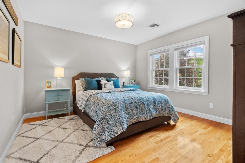 26 Cushing Road Westwood, MA 02090 - Photo 26 of 42 a bedroom with a bed and window