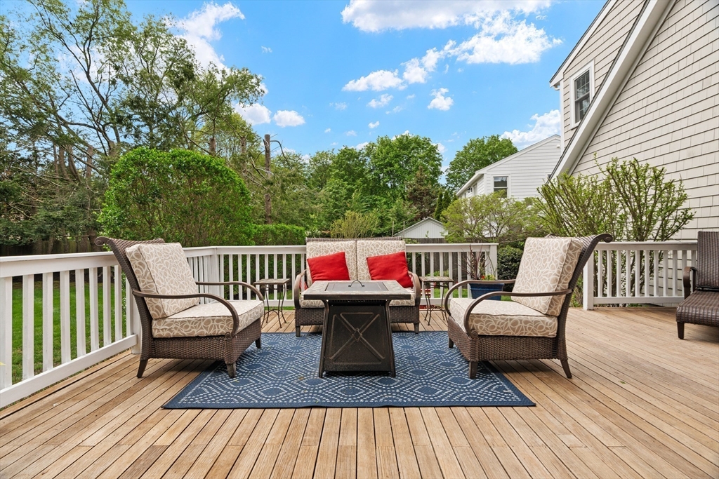 26 Cushing Road Westwood, MA 02090 - Photo 33 of 42 a roof deck with a table and chairs