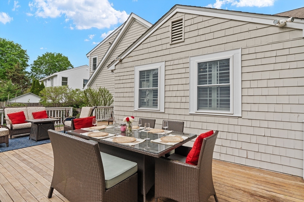 26 Cushing Road Westwood, MA 02090 - Photo 35 of 42 a terrace of a house with outdoor seating