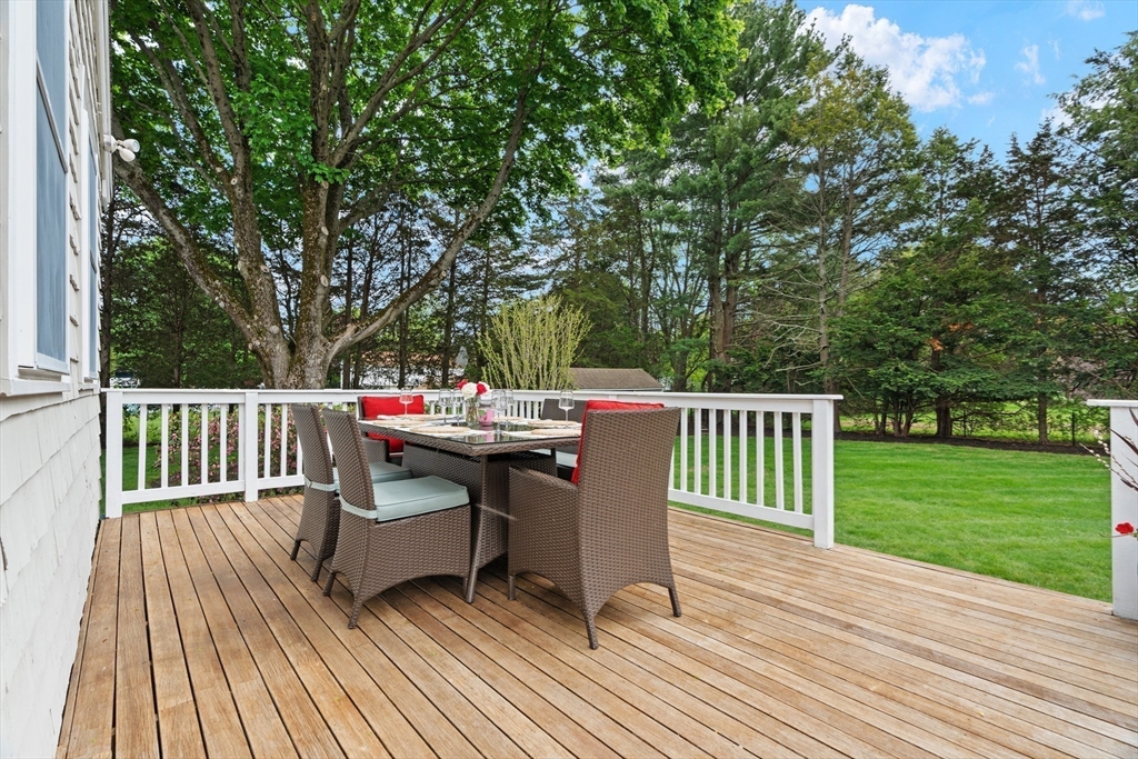 26 Cushing Road Westwood, MA 02090 - Photo 36 of 42 a view of a table and chairs on the roof deck