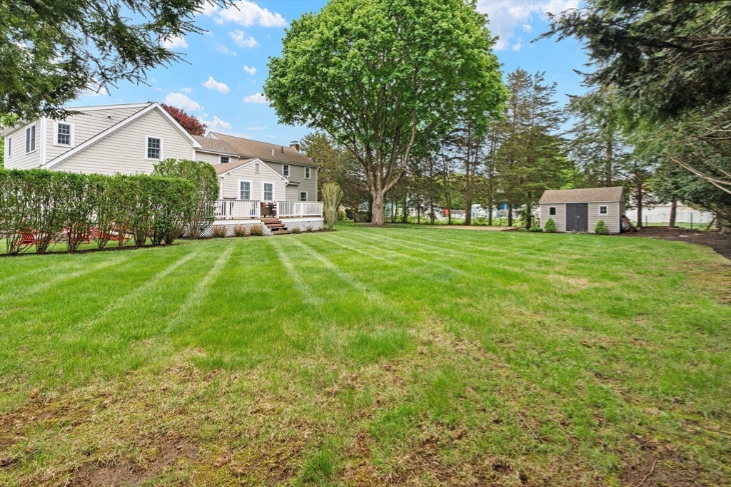 26 Cushing Road Westwood, MA 02090 - Photo 39 of 42 a front view of a house with a yard