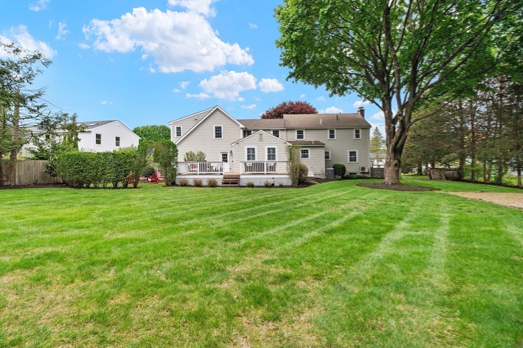 26 Cushing Road Westwood, MA 02090 - Photo 40 of 42 a view of a house with a big yard and large trees