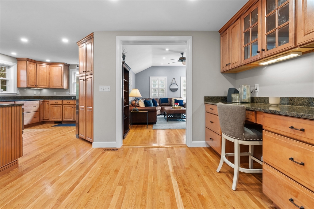 26 Cushing Road Westwood, MA 02090 - Photo 8 of 42 a kitchen with stainless steel appliances granite countertop wooden floors and view living room