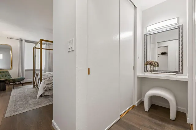 a view of a livingroom with furniture and a window