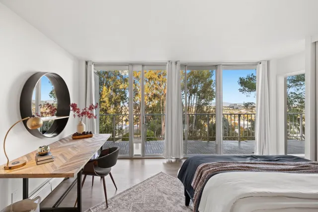 a bedroom with furniture and a window