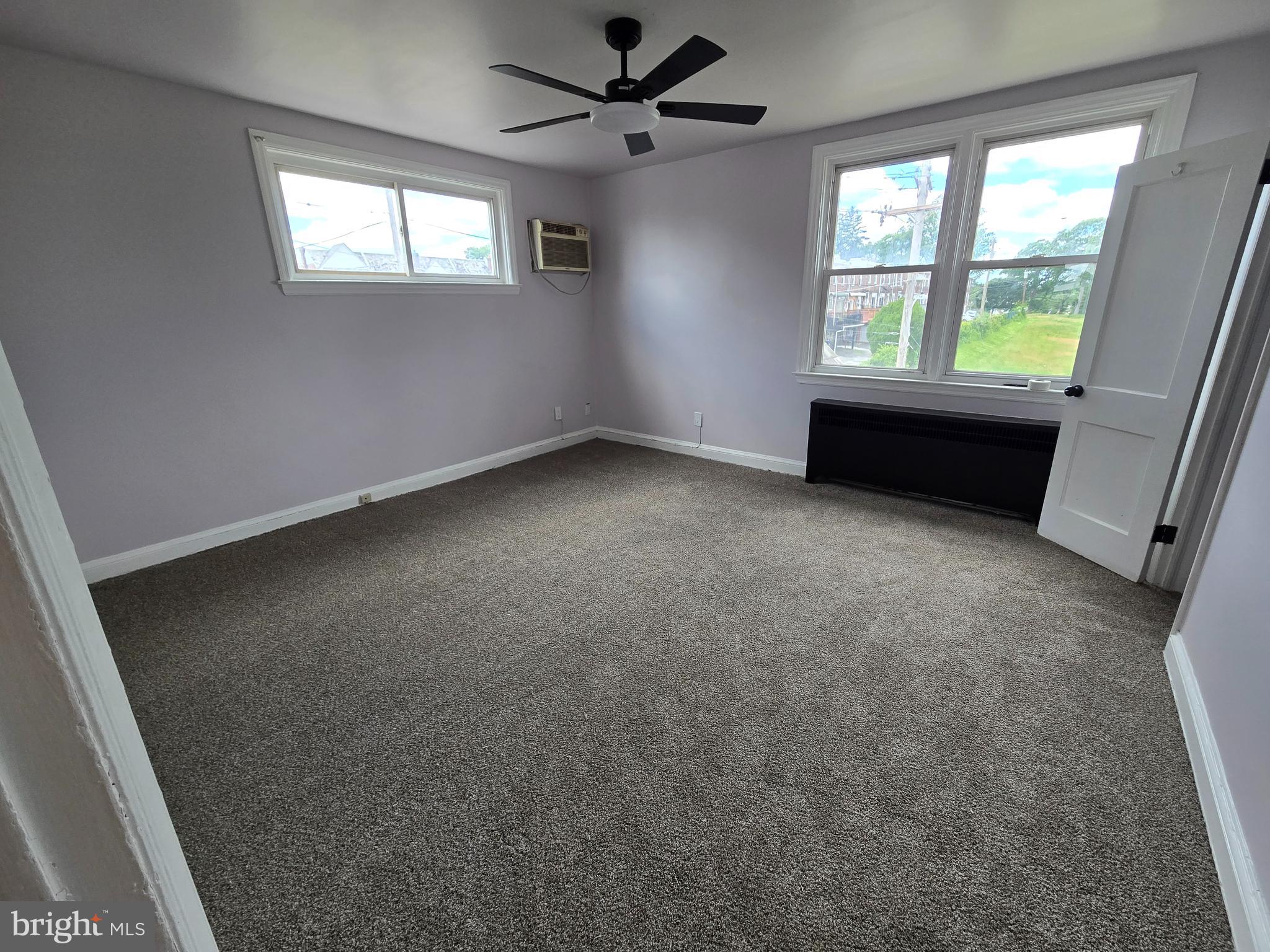 201 St Laurence Road Upper Darby, PA 19082 - Photo 26 of 37 an empty room with windows and ceiling fan