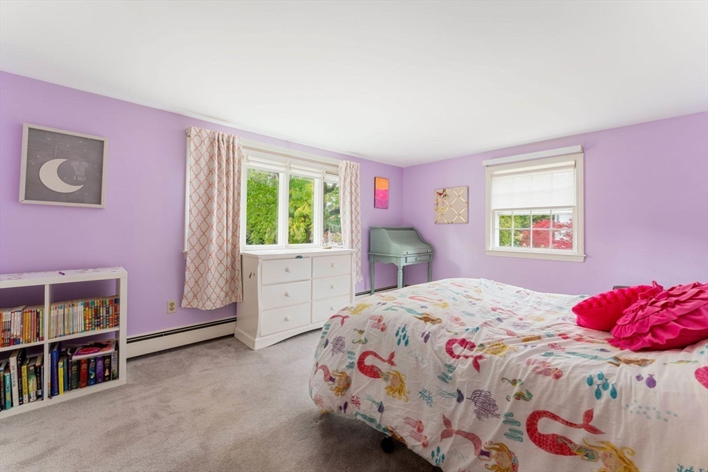 12 Winthrop Road Wayland, MA 01778 - Photo 14 of 22 a bedroom with a bed and a closet
