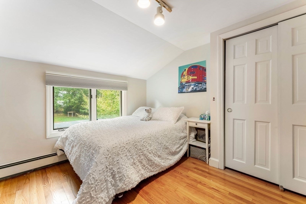 12 Winthrop Road Wayland, MA 01778 - Photo 15 of 22 a bed room with a bed and a window