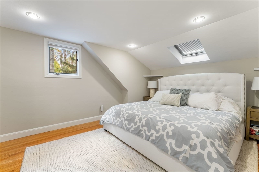 12 Winthrop Road Wayland, MA 01778 - Photo 16 of 22 a bedroom with a bed and a painting