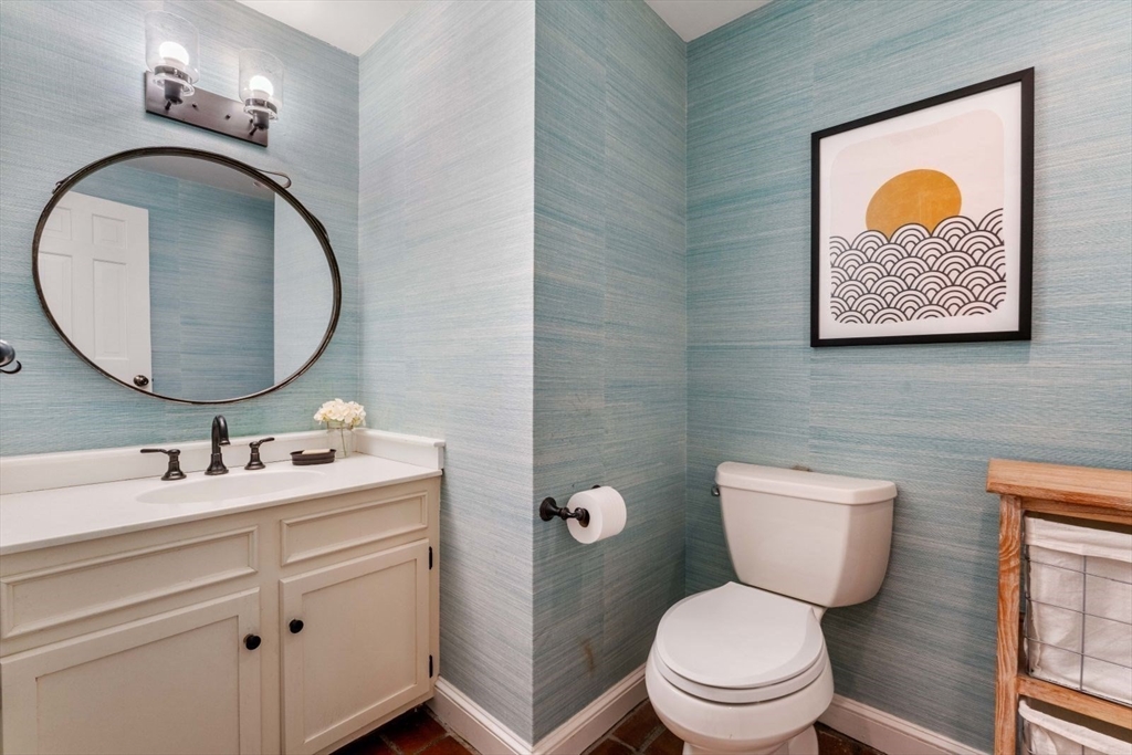 12 Winthrop Road Wayland, MA 01778 - Photo 18 of 22 a bathroom with a toilet sink vanity and mirror