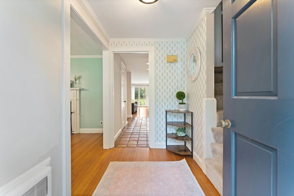 12 Winthrop Road Wayland, MA 01778 - Photo 3 of 22 a view of a hallway with wooden floor and living room