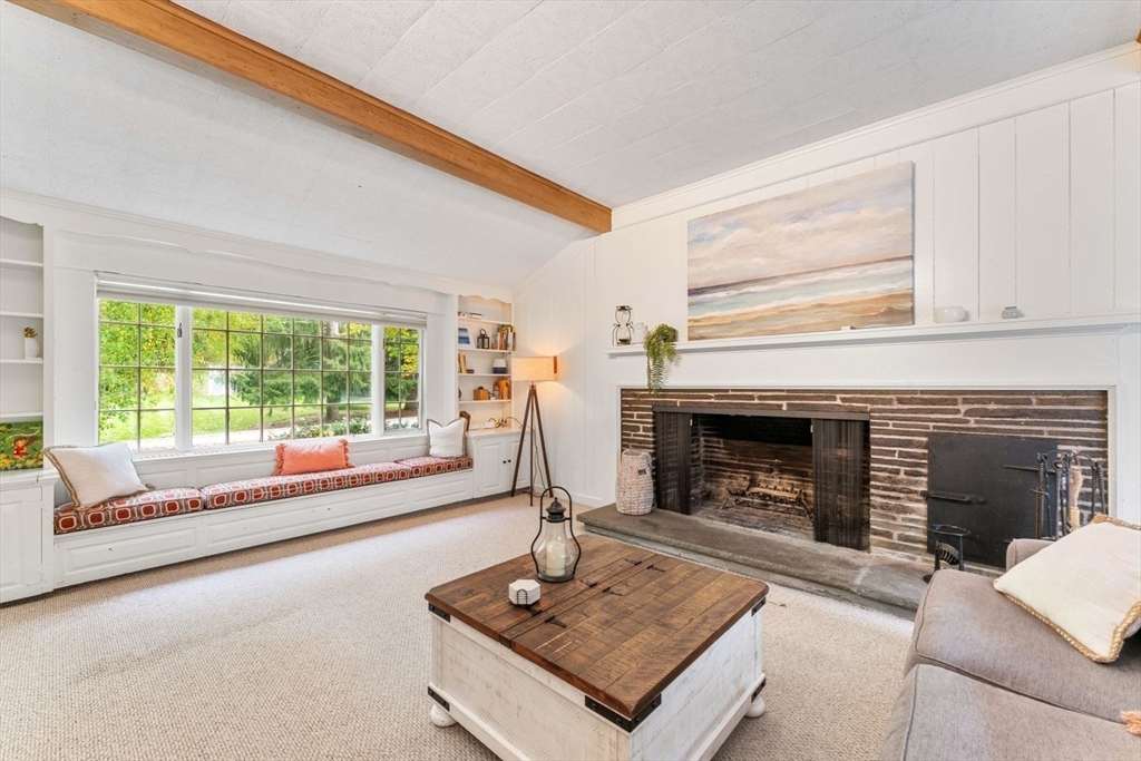 12 Winthrop Road Wayland, MA 01778 - Photo 6 of 22 a living room with furniture and a fireplace