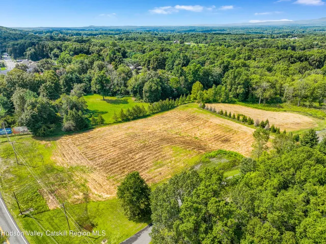 a view of a big yard with a lake