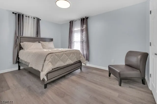 a bedroom with a bed and chair