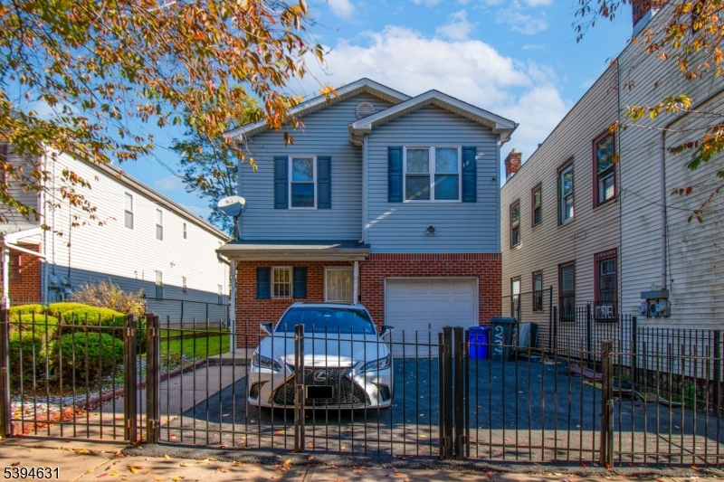 237 Rose Street, Unit 1 Newark, NJ 07108 - Photo 10 of 10 a front view of a building with street view