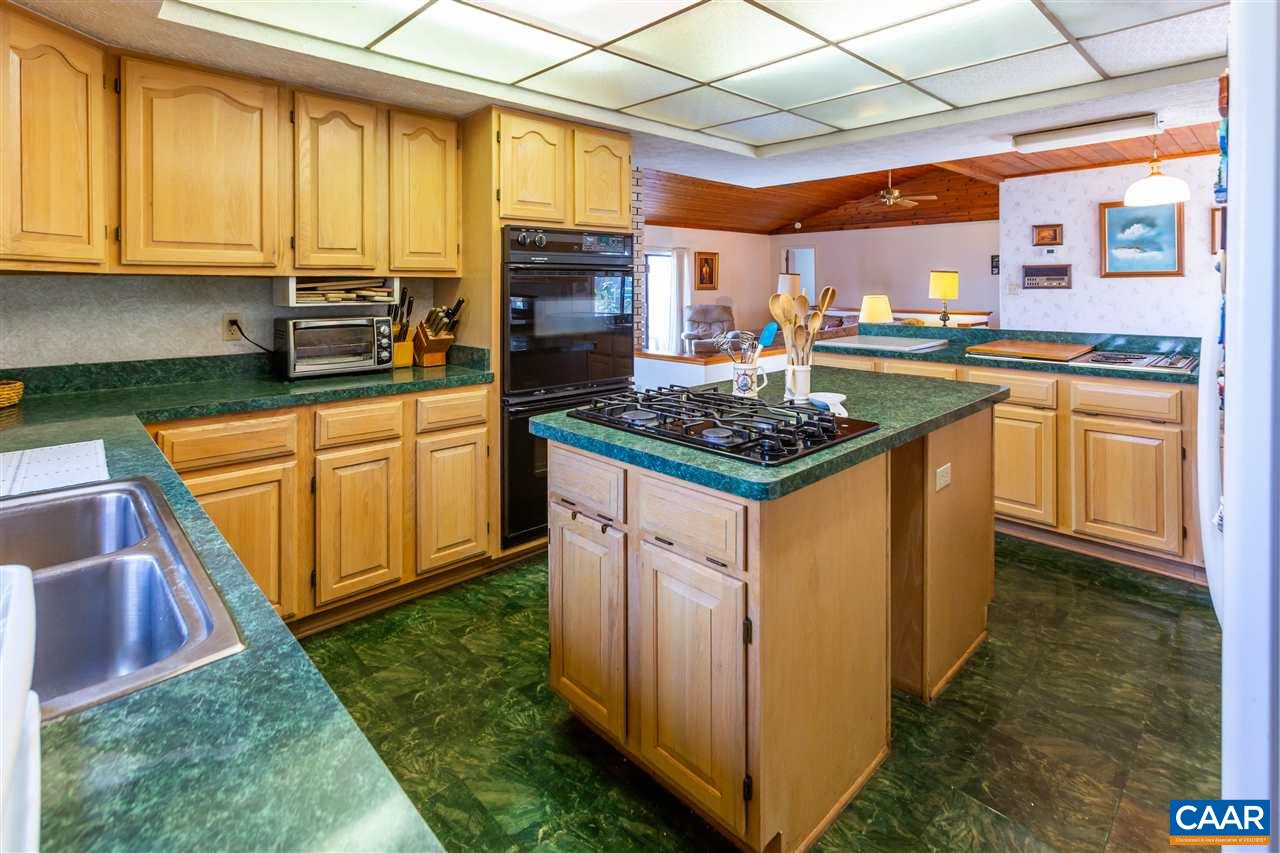 15 Condor Road Palmyra, VA 22963 - Photo 15 of 39 a kitchen with stainless steel appliances granite countertop a stove a sink and a microwave