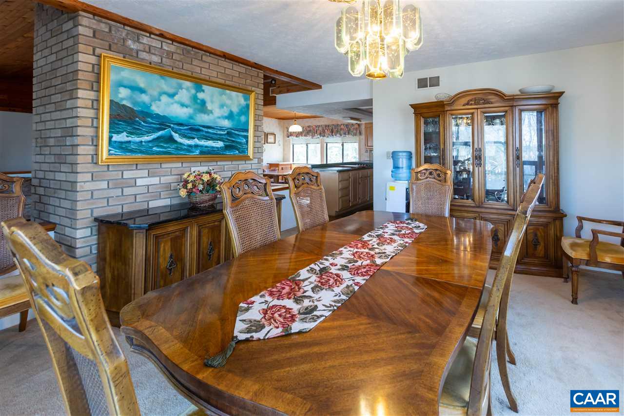 15 Condor Road Palmyra, VA 22963 - Photo 17 of 39 a view of a dining room with furniture a chandelier and wooden floor