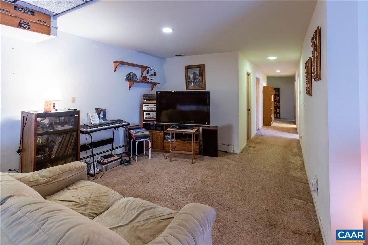 15 Condor Road Palmyra, VA 22963 - Photo 29 of 39 a living room with furniture and a flat screen tv