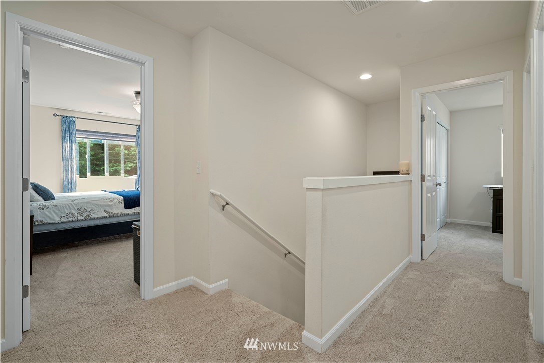 3032 183rd Place Southeast Bothell, WA 98012 - Photo 17 of 21 a view of a bedroom with a bed and a bathroom