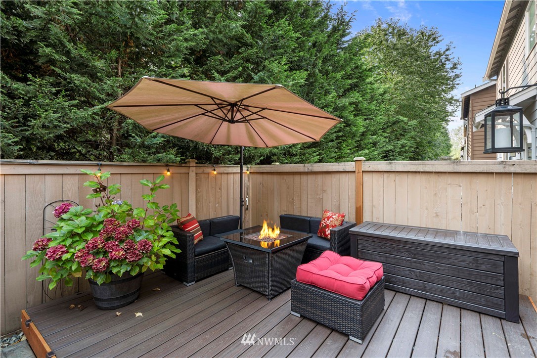 3032 183rd Place Southeast Bothell, WA 98012 - Photo 18 of 21 a view of a tables and chairs under an umbrella in the terrace