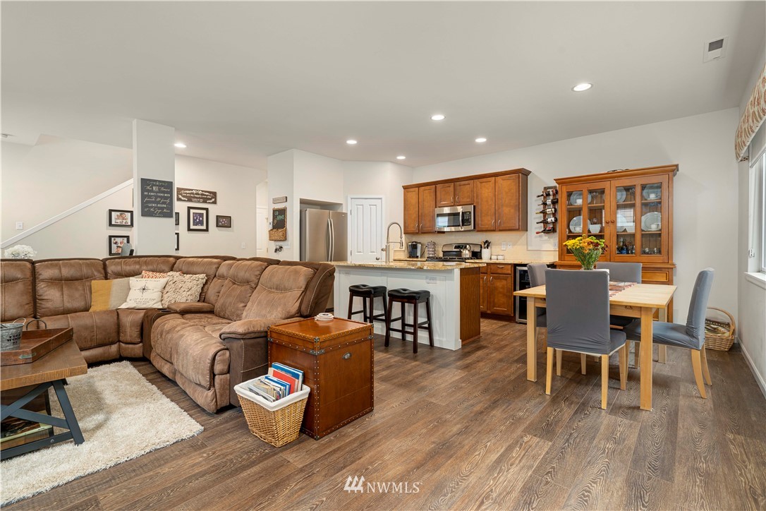 3032 183rd Place Southeast Bothell, WA 98012 - Photo 9 of 21 a living room with furniture and a wooden floor