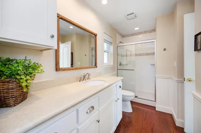a bathroom with a glass shower door