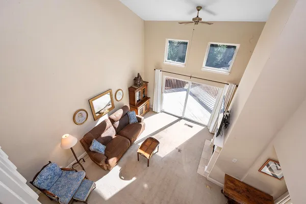 a bedroom with furniture and a rug