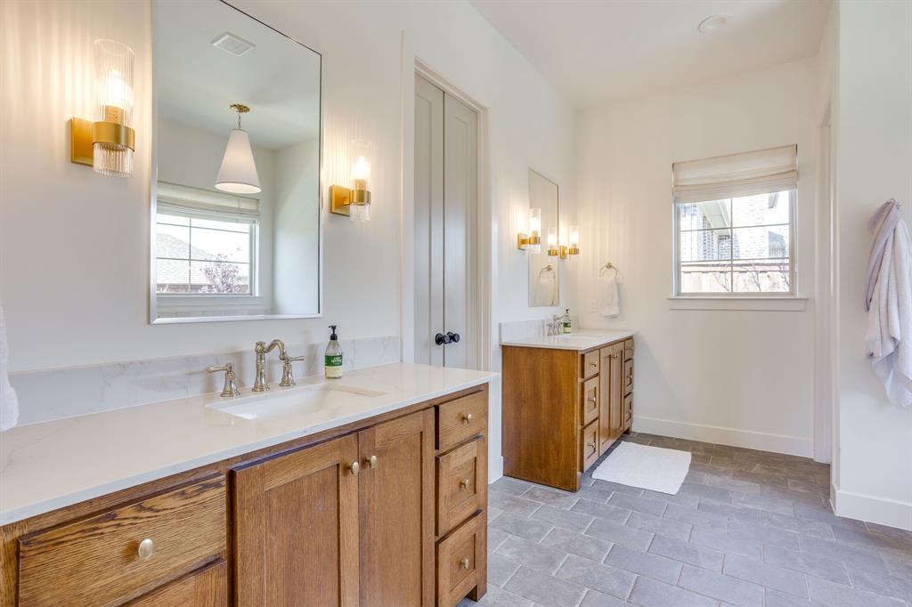 14000 Rozana Street Fort Worth, TX 76008 - Photo 19 of 38 a bathroom with a sink vanity and mirror